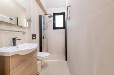 a bathroom with a sink and a toilet at Quattro Rise in Paralimni