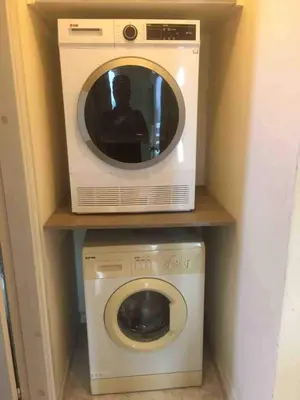 a microwave sitting on top of a washer and dryer at Lovely Paradise - 1-bd apt in Kapparis - Protaras in Paralimni