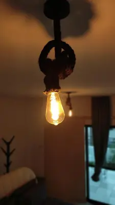 a light hanging from a ceiling in a bedroom at FLH - Feel Like Home Modern 1-Bedroom Ground floor Apartment in Strovolos in Kato Lakatamia