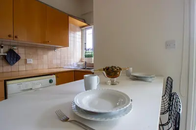a kitchen counter with a plate and a bowl on it at Central & Peaceful Nicosia 2BR in Nicosia