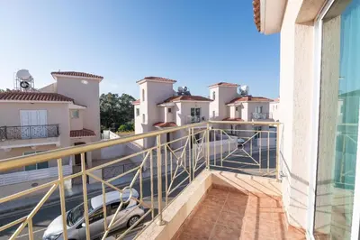a balcony of a house with a car on it at Pernera Gardens Villa Ekaterina in Protaras