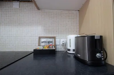 a coffee machine sitting on a counter in a room at Large Veranda 2BR Walk to Beach in Paralimni