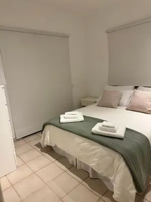 a bedroom with a large bed with towels on it at SWeET LEMON VILLA in Protaras