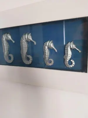 a picture of seahorses hanging on a wall at Cyprus Sun in Paralimni