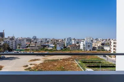 a view of a city from a balcony at Olympus 2-Bedroom Apartment in Larnaka
