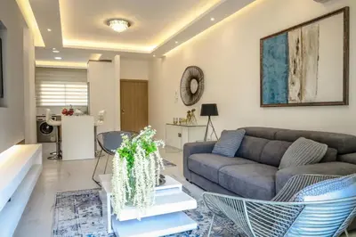 a living room with a couch and a table at Seaway moments in Limassol