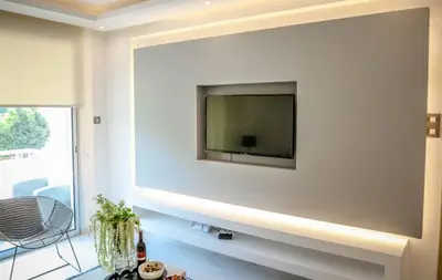 a living room with a flat screen tv on a wall at Seaway moments in Limassol
