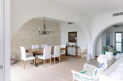 a dining room with a table and chairs at 3BR Beachfront Gem in Limassol in Limassol