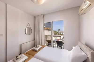a hotel room with a bed and a balcony at Villa Protaras View 6 Central Protaras -Fig Tree Bay-Jacuzzi-Hot Tub in Protaras