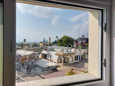 a view of a city from a window at Piazza Napa Studio Apts self serviced in Ayia Napa