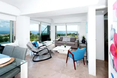a living room with a couch and chairs at Apartment Marisol - Beachfront in Protaras