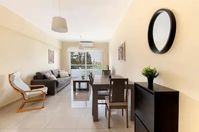 a living room with a table and a mirror at City Center, Nice View, 2BR in Larnaka