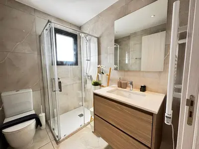 a bathroom with a shower and a sink and a toilet at Wealthystays Premium Residence in Nicosia