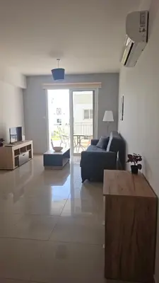a living room with a couch and a table at Obv 3206 in Pyla