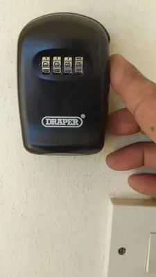 a person holding a electronic device in their hand at Beautiful 1-Bed House in Aglantzia
