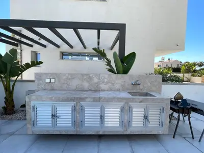 a white dresser sitting on top of a patio at City Napa Seaview Villas - Villa 2 in Ayia Napa