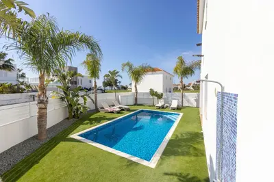 a swimming pool in the backyard of a house at Sweet Seaview Villa in Ayia Napa