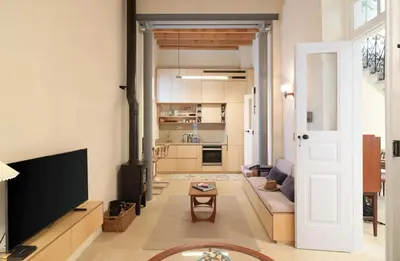 a living room with a couch and a tv at Timeless Gem in Old Nicosia in Nicosia