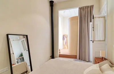 a mirror in a room with a bedroom at Timeless Gem in Old Nicosia in Nicosia