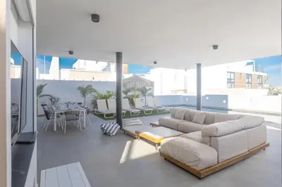 a living room with a couch and a table at Protaras Aqua Pearl Villa AQ18 in Protaras