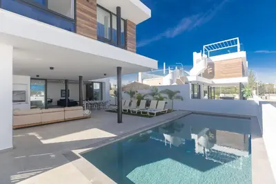 a swimming pool in the backyard of a house at Protaras Aqua Pearl Villa AQ18 in Protaras