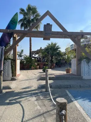 a wooden arch with a hose connected to a pool at Seaview City Retreat in Larnaka