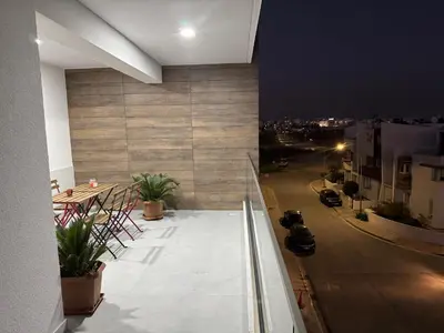 a balcony of a building with a view of a street at Brandnew Rooftop Flat near Larnaca Mall in Larnaka