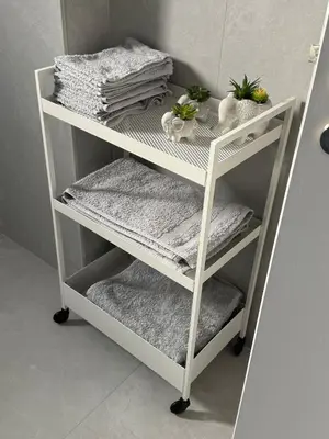 a white shelf with towels and towels on it at Brandnew Rooftop Flat near Larnaca Mall in Larnaka