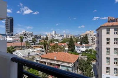 a view of a city from a balcony at Stylish Central Apartment • City Views • Prime Location • Parking in Nicosia