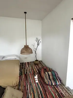 a bedroom with a bed with a large rug at Archontiko Papadopoulou in Mosphiloti