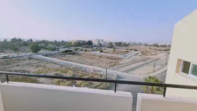 a view of a city from the balcony of a building at STAY Sea and Salt Lake Panoramic View Apt in Larnaka