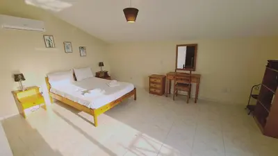 a bedroom with a bed and a table and a chair at STAY Sea and Salt Lake Panoramic View Apt in Larnaka
