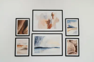 a group of framed pictures on a wall at 1 bedroom flat in city center in Nicosia
