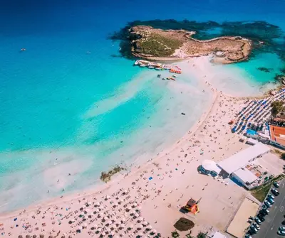 an overhead view of a beach with a crowd of people at Modern Seaside Retreat Near Nissi Beach in Ayia Napa