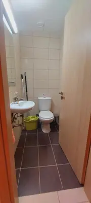 a bathroom with a toilet and a sink at Pyla Gardens A104 in Pyla