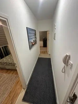a room with a hallway with a black carpet at 5 minutes to the sea in Kyrenia new port in Meniko