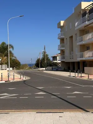 an empty street in front of a building at Stay With Oleg 102A in Paralimni