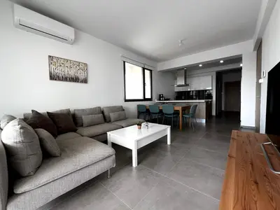 a living room with a couch and a table at Rachel 401 in Larnaka