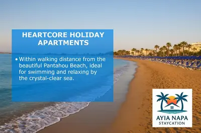a picture of a beach with a sign that reads healthcare holiday apartments at HeartCore Holiday Apartments in Ayia Napa