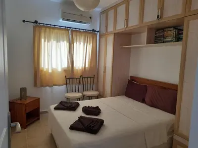 a bedroom with a bed with two towels on it at Crystal Bay Marina B3-5 in Troulli