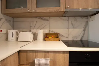 a kitchen with a counter top with a toaster at Modern 2BR Steps from Beach in Voroklini
