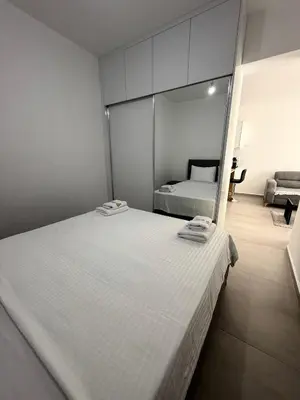 a bedroom with a large white bed in a room at Caesar Resort & SPA & Apartments Spacious Studio in Avgorou