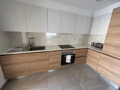 an empty kitchen with a sink and a stove at Mordern 2BD APT Perfect for Family or Group in Larnaka