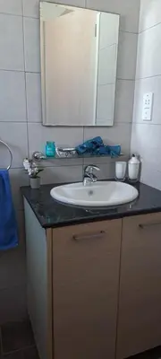 a bathroom with a sink and a mirror at Chromata means colorful for a much-needed sunny escape, check your stay! in Protaras