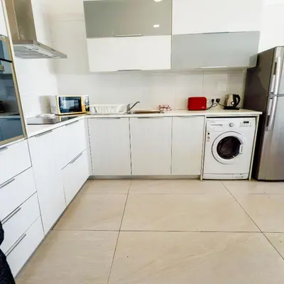 a kitchen with a washing machine and a washer at Azure Retreat in Ayia Napa