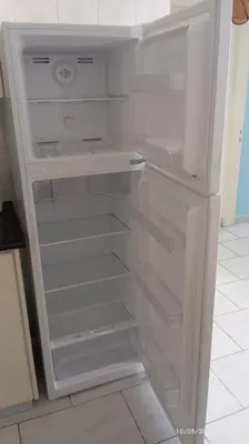 a white refrigerator with its door open in a kitchen at Emiliano 7 Holiday Apartment in Larnaka