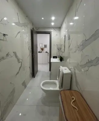 a bathroom with a toilet and a sink at Sia-Serenity Finikoudes Apartment in Larnaka