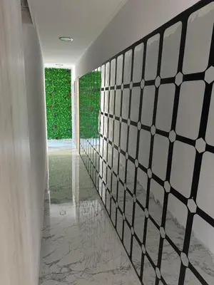 a hallway with a black and white tile wall at Emerald Luxe in Ayia Napa
