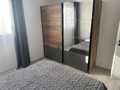 a bedroom with a large mirror and a bed at Emerald Luxe in Ayia Napa