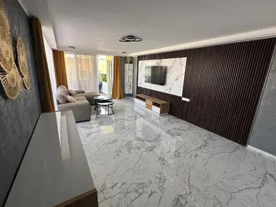 a living room with a marble floor at Emerald Luxe in Ayia Napa